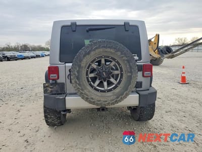 Zdjęcie 6 z 13 samochodu: 2014 JEEP WRANGLER UNLIMITED SAHARA VIN:1C4BJWEG7EL296431 - miniatura