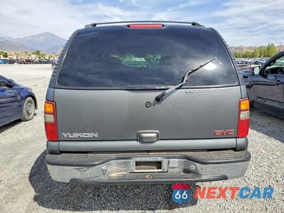 Zdjęcie 6 z 13 samochodu: 2002 GMC YUKON VIN:1GKEC13V22R127040 - miniatura