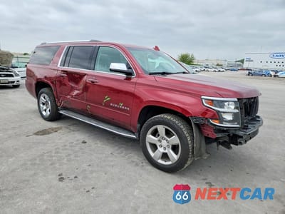 Czwarte zdjęcie samochodu z boku: 2016 CHEVROLET SUBURBAN K1500 LTZ VIN:1GNSKJKC0GR328435 - miniatura
