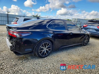 Trzecie zdjęcie samochodu z tyłu: 2024 TOYOTA CAMRY HYBRID SE VIN:4T1G31AK2RU623021 - miniatura