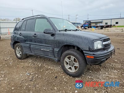 Czwarte zdjęcie samochodu z boku: 2004 CHEV TRACKER VIN:2CNBJ634346907874 - miniatura