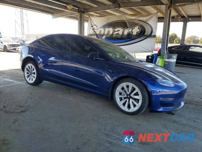 Czwarte zdjęcie samochodu z boku: 2021 TESLA MODEL 3 VIN:5YJ3E1EA3MF057404 - miniatura