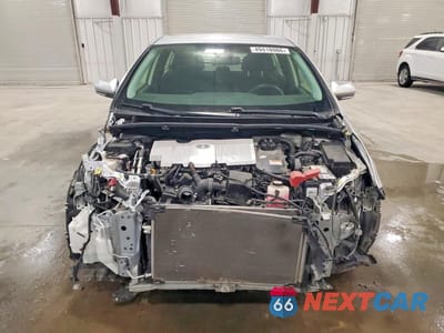 Piąte zdjęcie samochodu w środku: 2021 TOYOTA PRIUS L ECO VIN:JTDKAMFU3M3143438 - miniatura