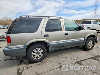 Trzecie zdjęcie samochodu z tyłu: 1999 GMC JIMMY VIN:1GKDT13WXX2549416 - miniatura