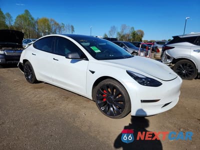 Czwarte zdjęcie samochodu z boku: 2023 TESLA MODEL 3 VIN:5YJ3E1EC7PF486034 - miniatura