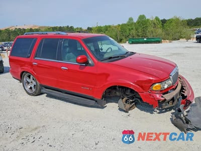Czwarte zdjęcie samochodu z boku: 2000 LINCOLN NAVIGATOR VIN:5LMEU27AXYLJ28611 - miniatura