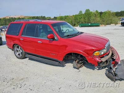 Czwarte zdjęcie samochodu z boku: 2000 LINCOLN NAVIGATOR VIN:5LMEU27AXYLJ28611 - miniatura