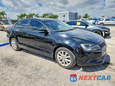 Czwarte zdjęcie samochodu z boku: 2011 VOLKSWAGEN JETTA SE VIN:3VWDX7AJ3BM307494 - miniatura