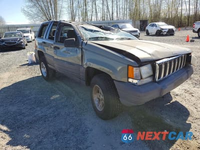 Czwarte zdjęcie samochodu z boku: 1998 JEEP GRAND CHEROKEE LAREDO VIN:1J4GZ58S0WC110636 - miniatura