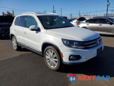 Czwarte zdjęcie samochodu z boku: 2014 VOLKSWAGEN TIGUAN S VIN:WVGAV3AX4EW556248 - miniatura