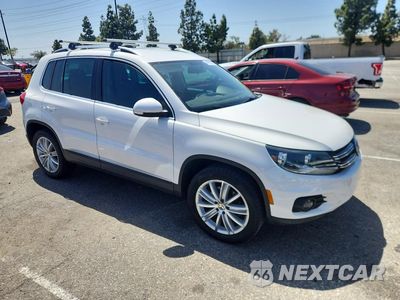 Czwarte zdjęcie samochodu z boku: 2014 VOLKSWAGEN TIGUAN S VIN:WVGAV3AX4EW550496 - miniatura
