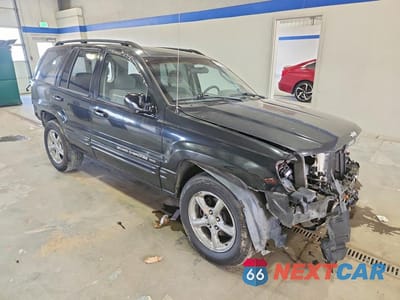 Czwarte zdjęcie samochodu z boku: 2004 JEEP GRAND CHEROKEE LAREDO VIN:1J4GX48S74C171124 - miniatura
