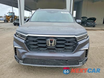 Piąte zdjęcie samochodu w środku: 2025 HONDA PILOT TOURING VIN:5FNYG1H78SB048050 - miniatura