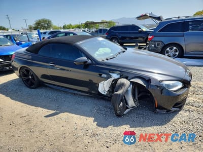 Czwarte zdjęcie samochodu z boku: 2015 BMW M6 VIN:WBSLZ9C5XFD651483 - miniatura