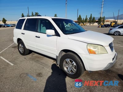 Czwarte zdjęcie samochodu z boku: 2003 HONDA PILOT EX VIN:2HKYF18403H591582 - miniatura