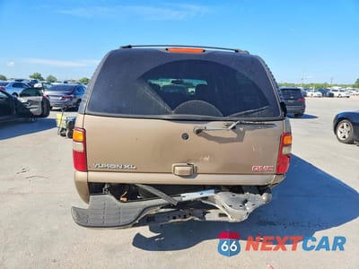Zdjęcie 6 z 13 samochodu: 2003 GMC YUKON XL C1500 VIN:1GKEC16Z13J178138 - miniatura