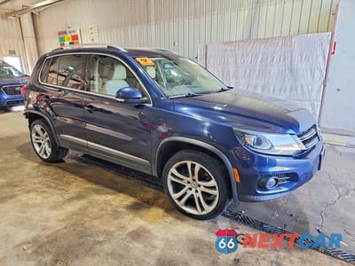 Czwarte zdjęcie samochodu z boku: 2013 VOLKSWAGEN TIGUAN S VIN:WVGBV7AX7DW536604 - miniatura