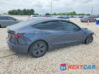 Trzecie zdjęcie samochodu z tyłu: 2023 TESLA MODEL 3 VIN:5YJ3E1EA4PF695178 - miniatura