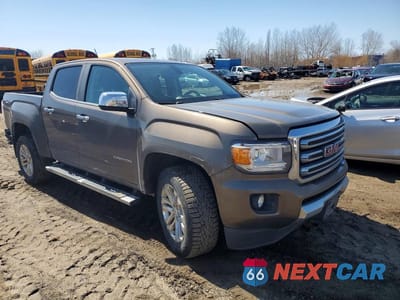 Czwarte zdjęcie samochodu z boku: 2016 GMC CANYON SLT VIN:1GTG6DE38G1261243 - miniatura