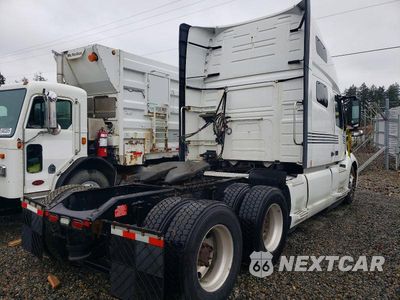 Czwarte zdjęcie samochodu z boku: 2019 VOLVO VNL SEMI TRUCK VIN:4V4NC9EH8KN193833 - miniatura