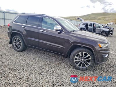 Czwarte zdjęcie samochodu z boku: 2017 JEEP GRAND CHEROKEE OVERLAND VIN:1C4RJFCG2HC777354 - miniatura