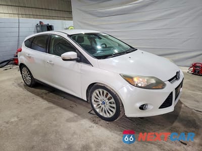 Czwarte zdjęcie samochodu z boku: 2012 FORD FOCUS TITANIUM VIN:1FAHP3N25CL144954 - miniatura