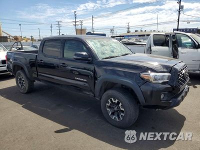 Czwarte zdjęcie samochodu z boku: 2017 TOYOTA TACOMA DOUBLE CAB VIN:3TMDZ5BNXHM017703 - miniatura