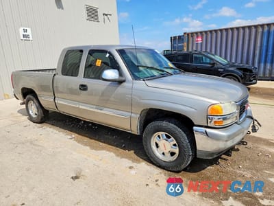 Czwarte zdjęcie samochodu z boku: 1999 GMC NEW SIERRA K1500 VIN:1GTEK19T1XE501477 - miniatura