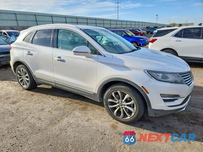 Czwarte zdjęcie samochodu z boku: 2015 LINCOLN MKC VIN:5LMCJ2A92FUJ38054 - miniatura