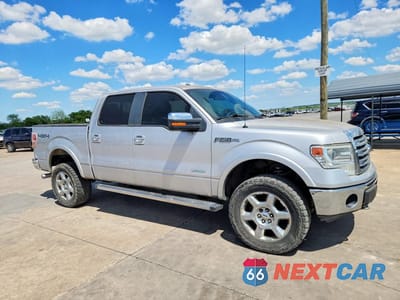 Czwarte zdjęcie samochodu z boku: 2014 FORD F150 SUPERCREW VIN:1FTFW1ET5EKE16994 - miniatura