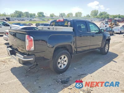 Trzecie zdjęcie samochodu z tyłu: 2015 GMC CANYON VIN:1GTG5AEA1F1250597 - miniatura