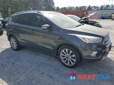 Czwarte zdjęcie samochodu z boku: 2017 FORD ESCAPE TITANIUM VIN:1FMCU0JD7HUD42712 - miniatura
