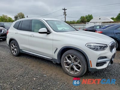 Czwarte zdjęcie samochodu z boku: 2021 BMW X3 XDRIVE30E VIN:5UXTS1C02M9E52124 - miniatura