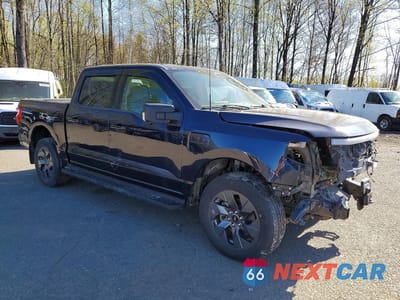 Czwarte zdjęcie samochodu z boku: 2023 FORD F150 LIGHTNING PRO VIN:1FT6W1EV9PWG42582 - miniatura