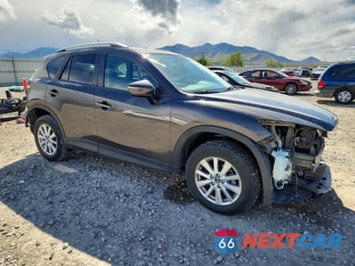 Czwarte zdjęcie samochodu z boku: 2016 MAZDA CX-5 TOURING VIN:JM3KE4CY9G0866770 - miniatura