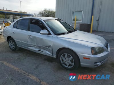 Czwarte zdjęcie samochodu z boku: 2004 HYUNDAI ELANTRA GLS VIN:KMHDN46D84U788458 - miniatura