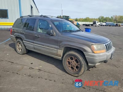 Czwarte zdjęcie samochodu z boku: 1999 JEEP GRAND CHEROKEE LAREDO VIN:1J4GW58N9XC804505 - miniatura