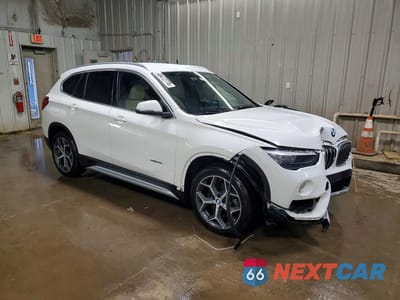 Czwarte zdjęcie samochodu z boku: 2018 BMW X1 XDRIVE28I VIN:WBXHT3C32J5K31653 - miniatura