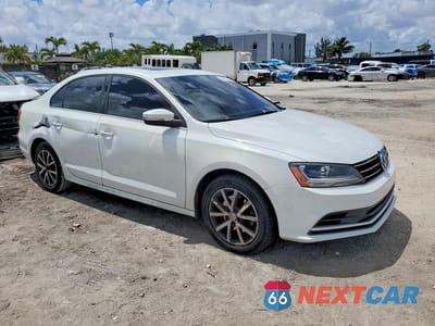 Czwarte zdjęcie samochodu z boku: 2017 VOLKSWAGEN JETTA SE VIN:3VWDB7AJ4HM398301 - miniatura