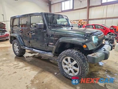 Czwarte zdjęcie samochodu z boku: 2011 JEEP WRANGLER UNLIMITED SAHARA VIN:1J4BA5H16BL620752 - miniatura