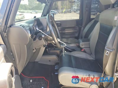 Zdjęcie 7 z 12 samochodu: 2010 JEEP WRANGLER UNLIMITED SAHARA VIN:1J4HA5H15AL213434 - miniatura