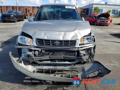 Piąte zdjęcie samochodu w środku: 2000 TOYOTA RAV4 BASE VIN:JT3GP10V2Y7071199 - miniatura