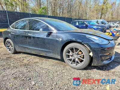 Czwarte zdjęcie samochodu z boku: 2019 TESLA MODEL 3 VIN:5YJ3E1EA9KF301702 - miniatura