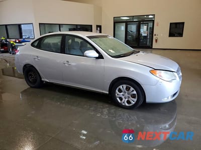 Czwarte zdjęcie samochodu z boku: 2010 HYUNDAI ELANTRA GLS VIN:KMHDU4AD6AU837906 - miniatura