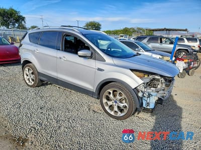 Czwarte zdjęcie samochodu z boku: 2014 FORD ESCAPE TITANIUM VIN:1FMCU0J90EUB16275 - miniatura