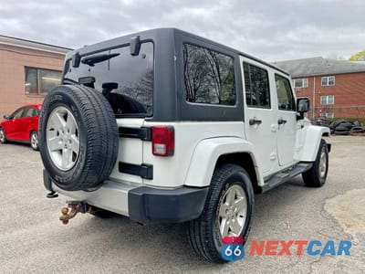 Czwarte zdjęcie samochodu z boku: 2015 JEEP WRANGLER UNLIMITED SAHARA VIN:1C4BJWEGXFL540381 - miniatura