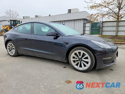 Czwarte zdjęcie samochodu z boku: 2022 TESLA MODEL 3 VIN:5YJ3E1EA6NF371453 - miniatura