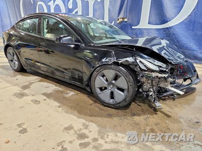 Czwarte zdjęcie samochodu z boku: 2023 TESLA MODEL 3 VIN:5YJ3E1EA7PF448995 - miniatura