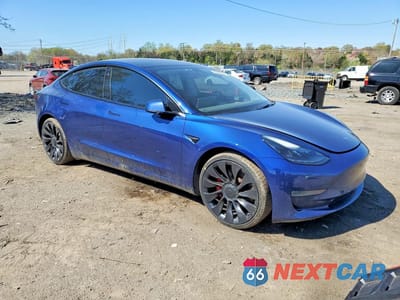 Czwarte zdjęcie samochodu z boku: 2022 TESLA MODEL 3 VIN:5YJ3E1ECXNF203090 - miniatura