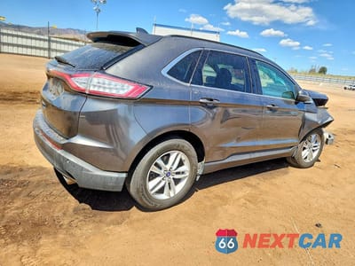 Trzecie zdjęcie samochodu z tyłu: 2015 FORD EDGE SEL VIN:2FMTK4J88FBB35264 - miniatura